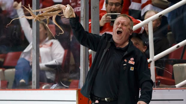 Red Wings zamboni driver Al Sobotka swings an octopus around prior to the game against the Canadiens.